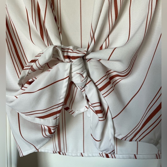 White medium crop top with orange stripes and bell sleeves. Cute and casual. - Picture 2 of 5